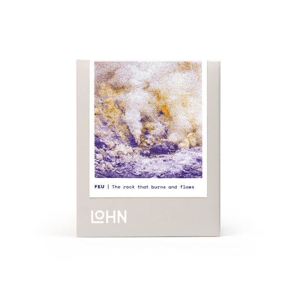 lohn feu oraganic coconut and soy wax hand poured candle in box with purple and yellow label