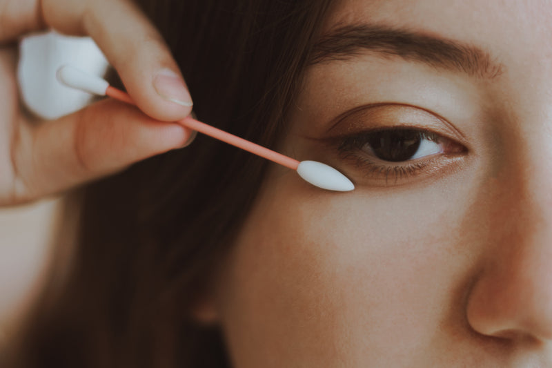 women using reusable makeup cotton swab made of silicone for under eye makeup