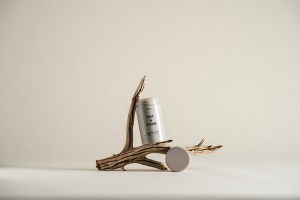 salt and stone santal natural deodorant on sandal wood branch