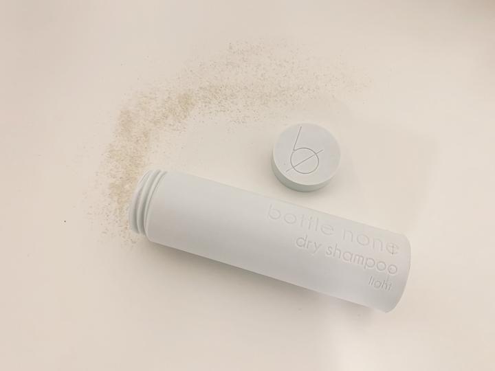 bottle none natural dry shampoo for light hair coming out of white 3D printed container