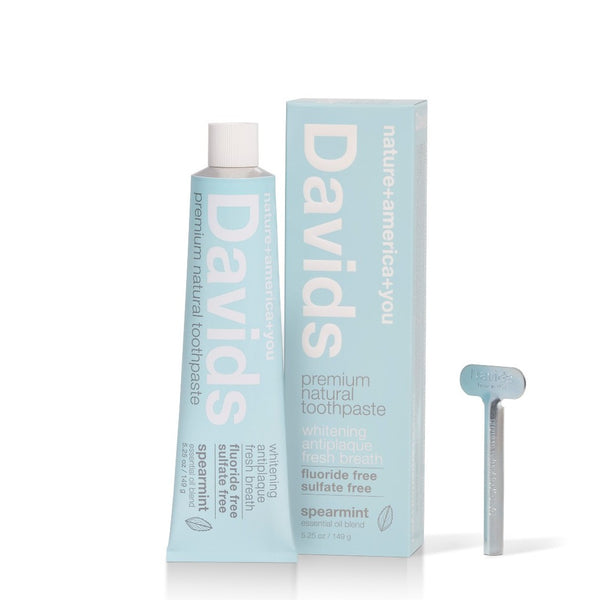 davids premium natural toothpaste spearmint box tube and metal key upright against white background