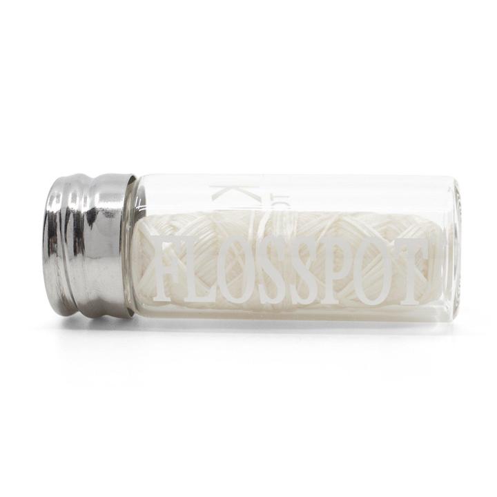floss pot biodegradable silk dental floss in glass mason jar container laying on side