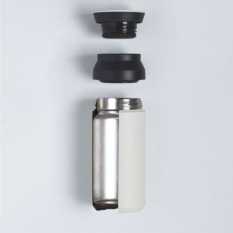 travel tumbler with all three part separated, top lid, middle and bottom container 