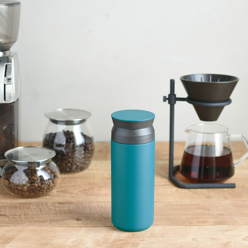 turquoise kinto insulted coffee tumbler on coffee counter