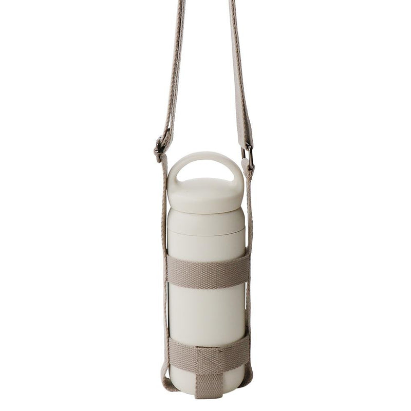 kinto medium beige bottle strap with day off tumbler in it
