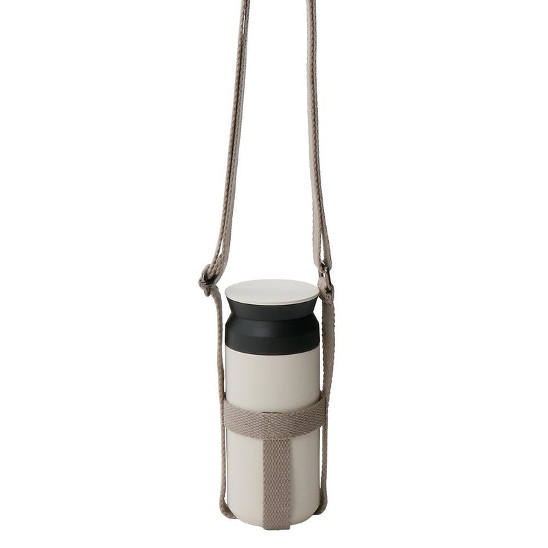 kinto bottle strap small in beige with 350ml travel tumbler in it