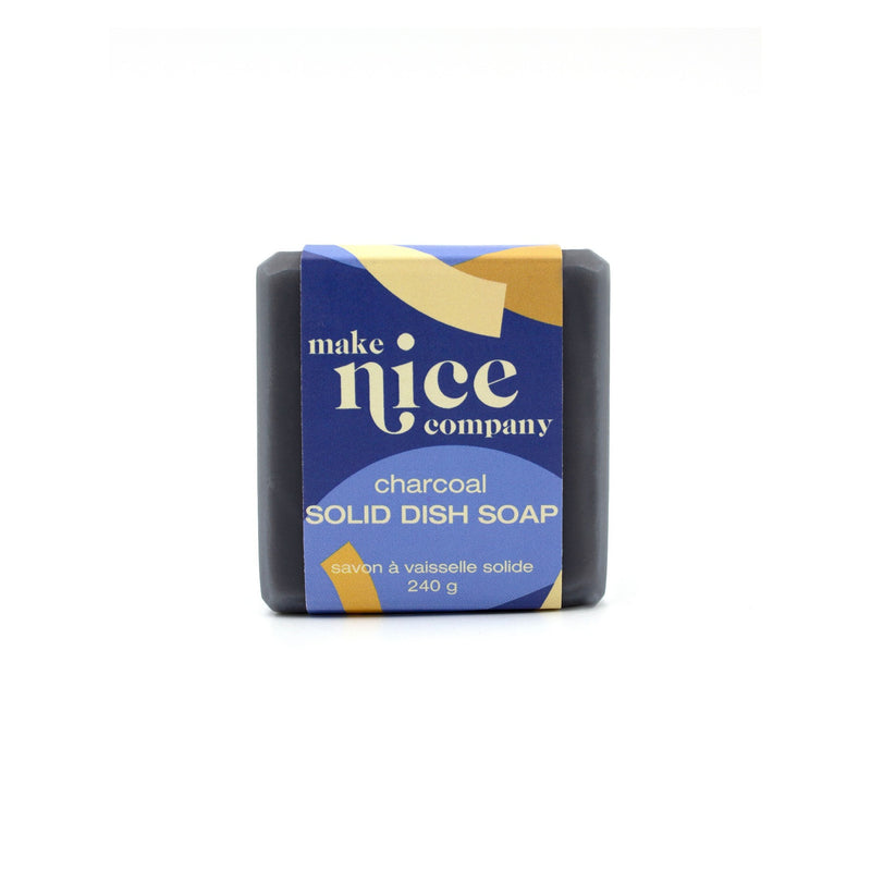 make nice company charcoal black solid dish soap with blue paper label around against white background