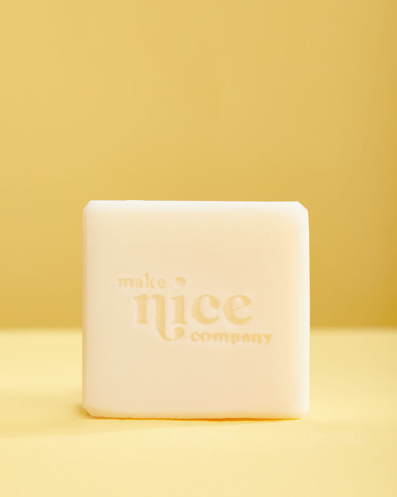 make nice company unscented solid dish soap unpacked against yellow background