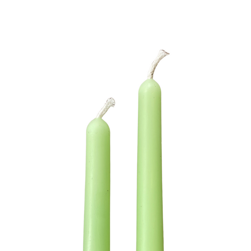 two mint coloured beeswax taper candles