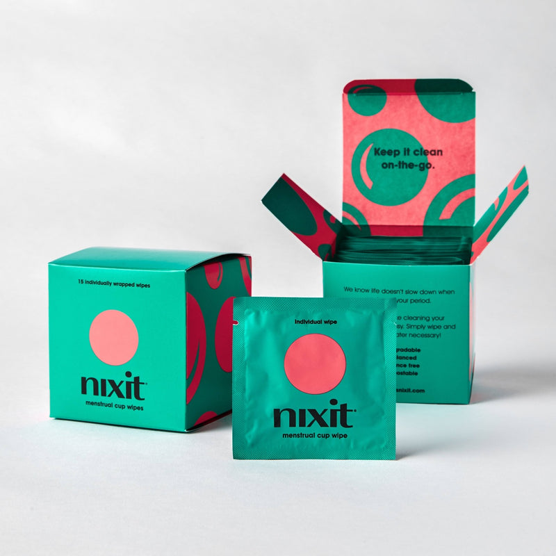 two boxes of nixit wipes one open and a single wipe packaged in front
