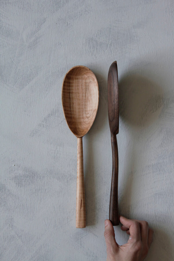 woodsmans daughter maple oval serving spoon laid flat with side profile of walnut serving spoon