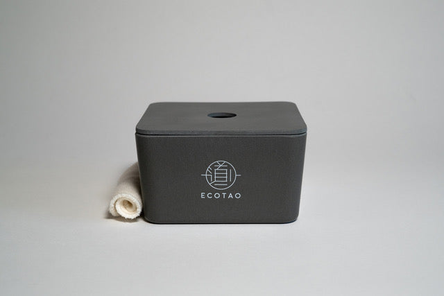 biodegradable grey bamboo fibre box for reusable facial rounds with a facial wipe rolled on the side