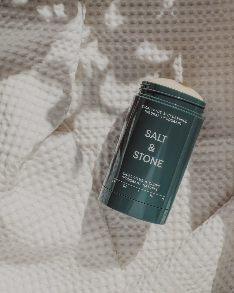 opened salt and stone natural deodorant eucalyptus and cedarwood on white towel salt and stone