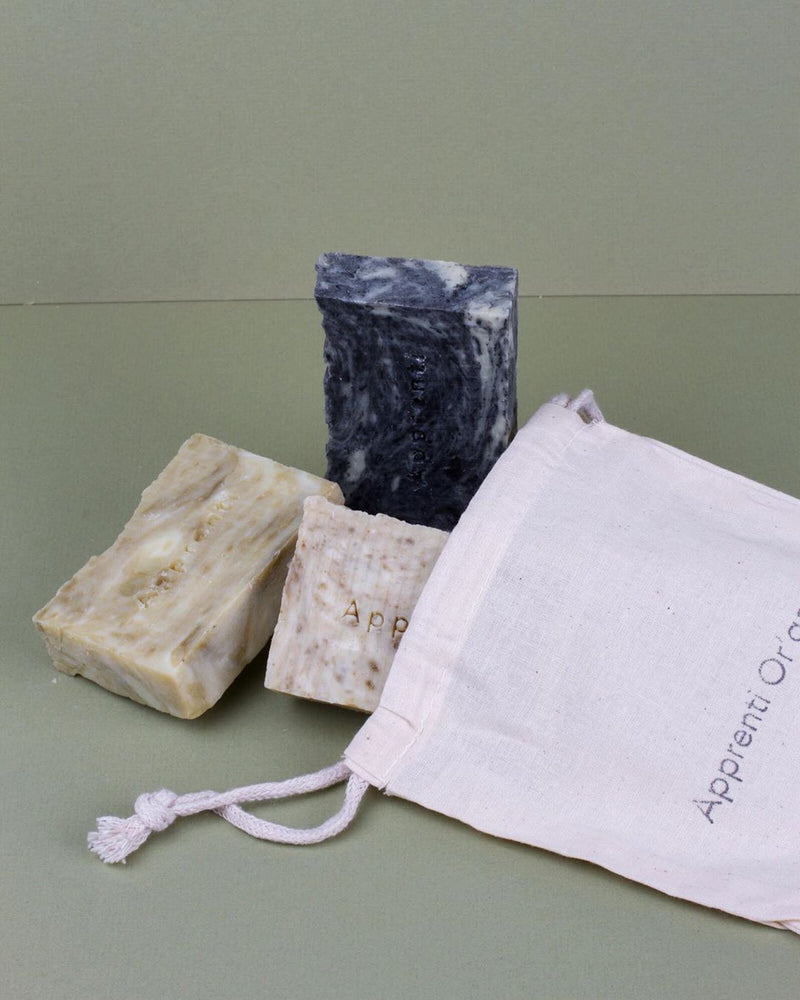 apprenti organik handmade natural biodegradable soap laid across green background