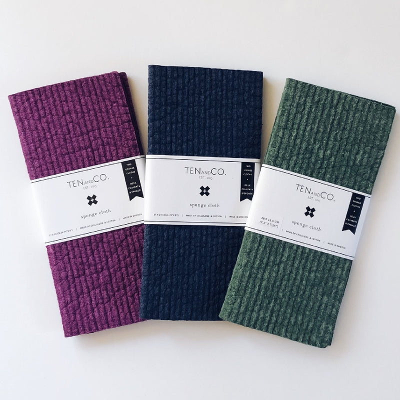 ten and co plant dyed two pack sponge cloths in plum navy and green fanned out on white background