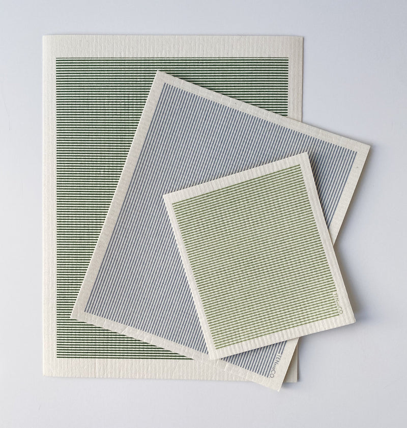 three ten and co striped compostable sponge cloths laid on top of each other