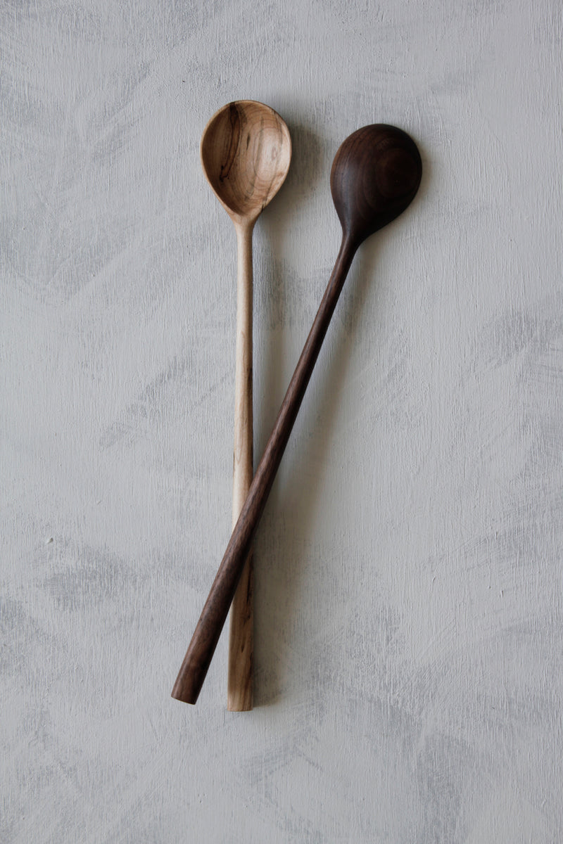 woodsmans daughter maple and walnut long stirring spoons laid atop one another showing front and backside of spoon