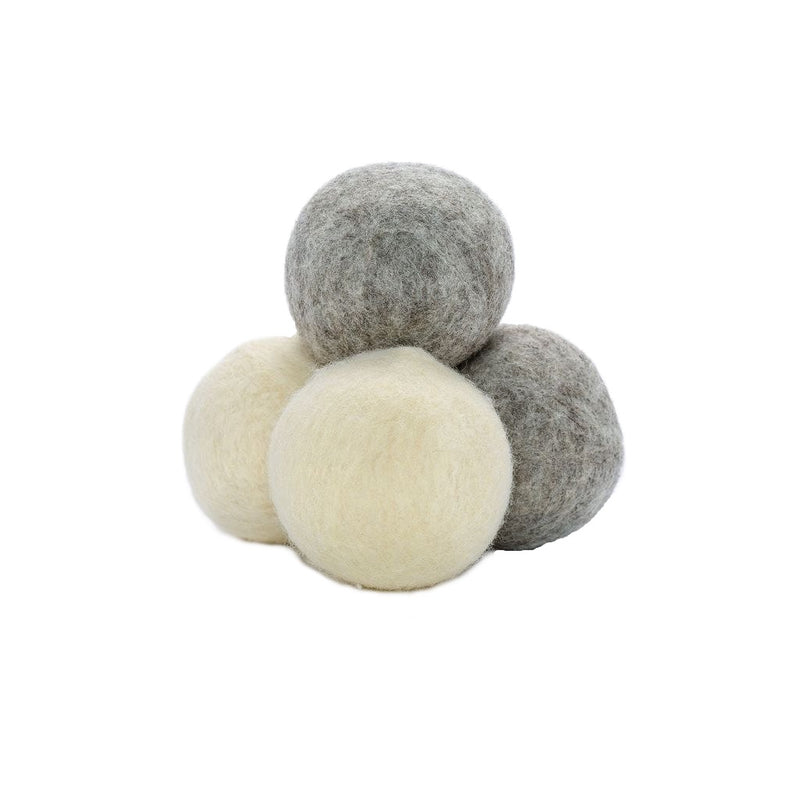 white and grey wool drier balls stacked