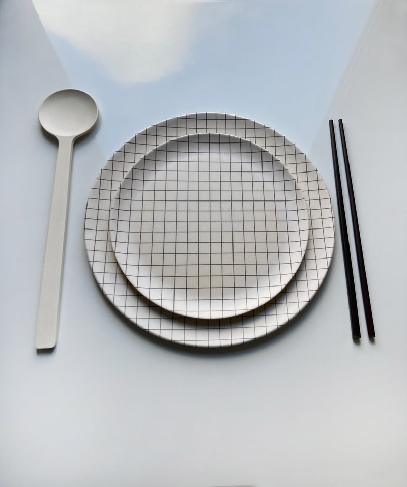 sustianable bamboo plate setting dinner and side plate metric stacked with spoon and chopsticks along side
