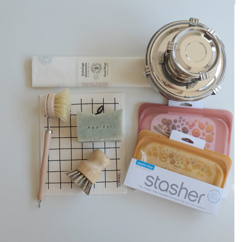 zerowaste kitchen kit with beeswax wrap onyx containers stasher bags solid dish soap block sponge cloth two bamboo dish brushes